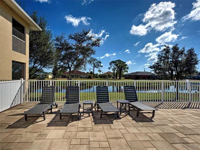 a view of a swimming pool with a patio
