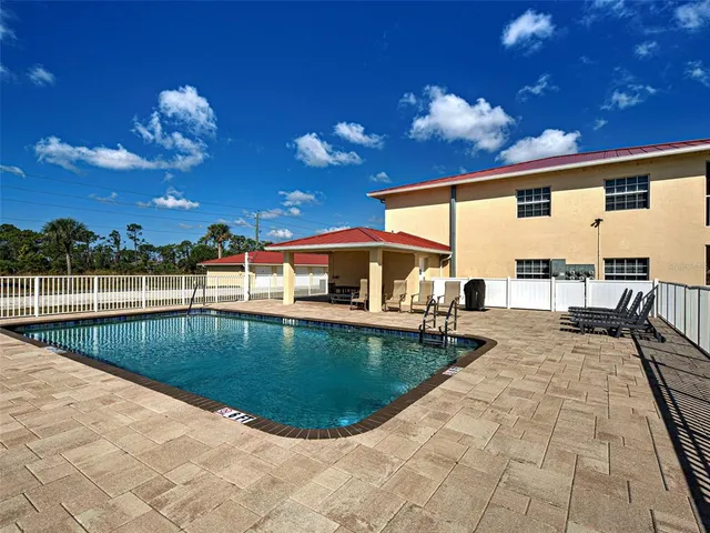 a view of a house with swimming pool