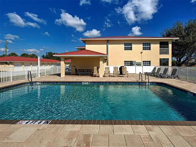 a view of a hallway with a wooden door