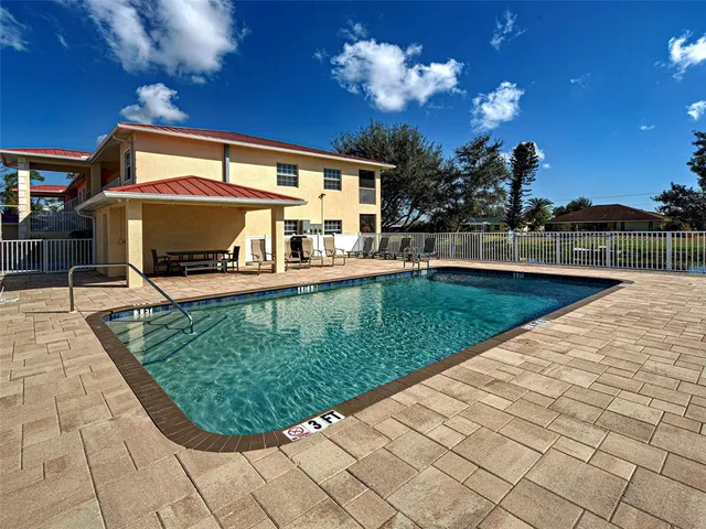 a kitchen with stainless steel appliances a refrigerator and a stove top oven