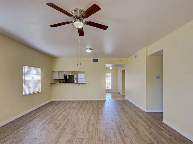 a view of an empty room with a window