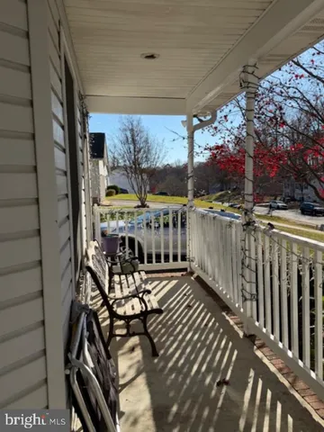 a view of a patio with a table and chairs