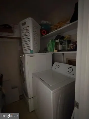 a view of storage and utility room with washer and dryer