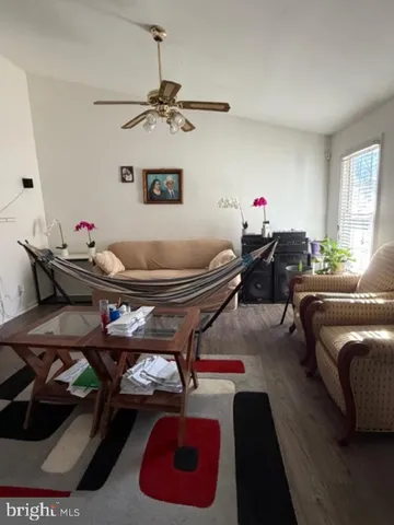 a living room with furniture and window