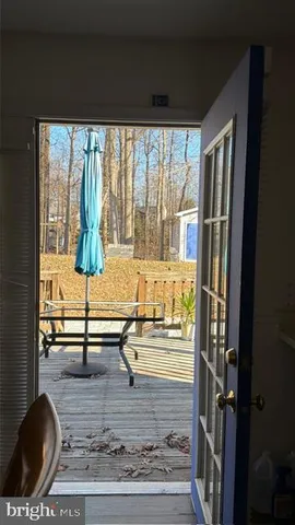 a view of living room with furniture and window