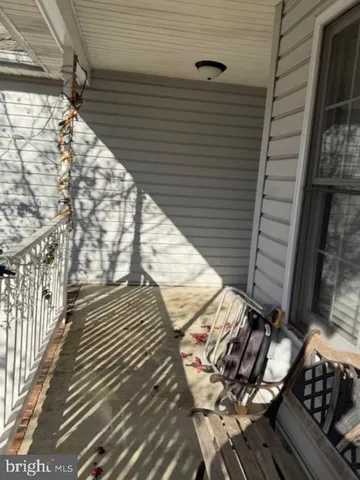 a view of a balcony with wooden floor