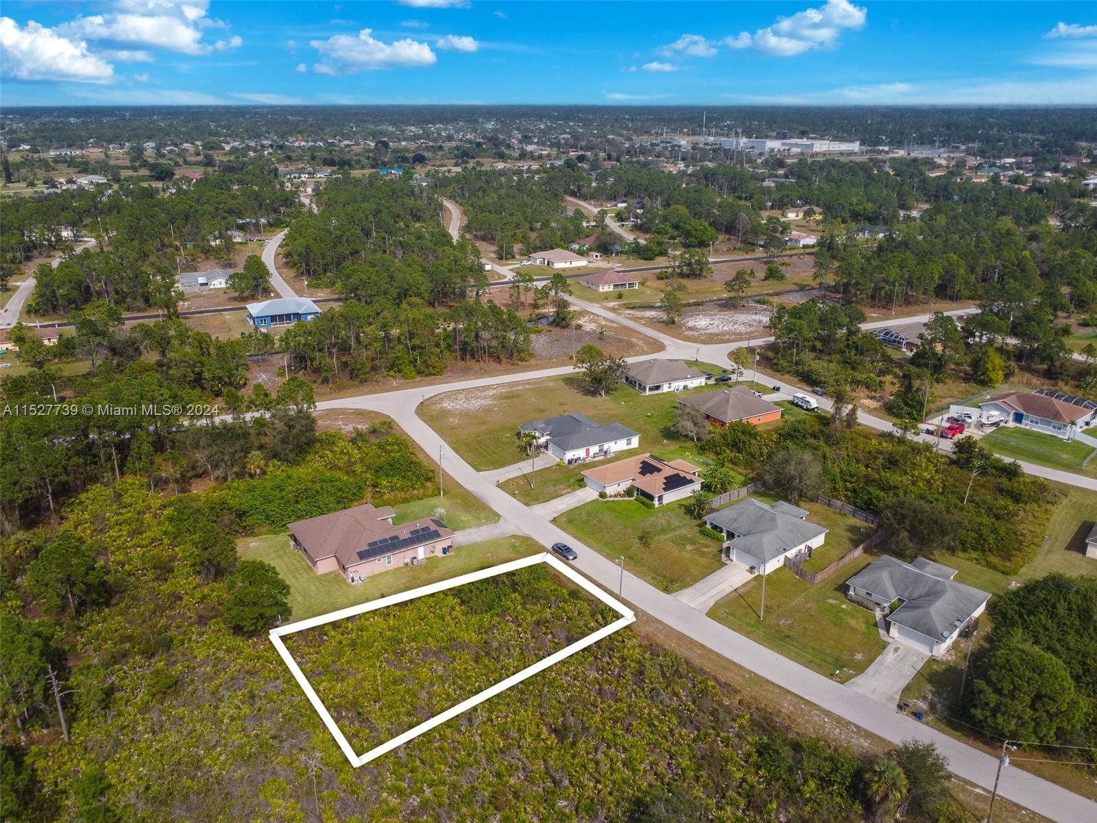 752 Breamer Avenue South Lehigh Acres, FL 33974 - Photo 2 of 10 an aerial view of residential houses with outdoor space