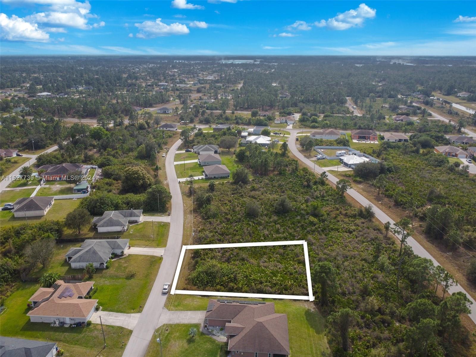 752 Breamer Avenue South Lehigh Acres, FL 33974 - Photo 3 of 10 an aerial view of residential houses with city view