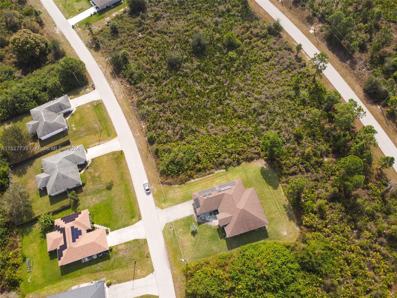 752 Breamer Avenue South Lehigh Acres, FL 33974 - Photo 5 of 10 an aerial view of residential house with outdoor space