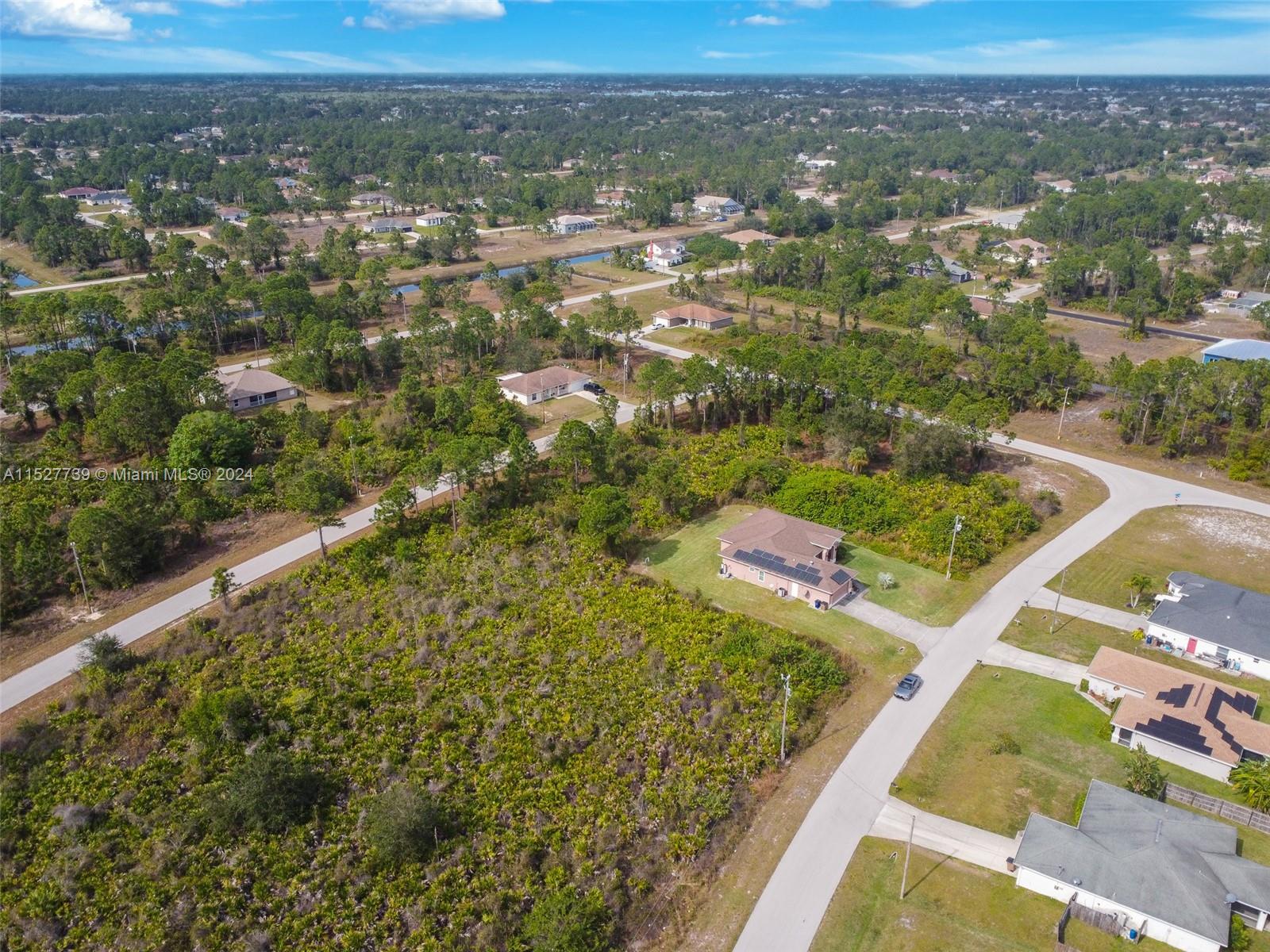 752 Breamer Avenue South Lehigh Acres, FL 33974 - Photo 7 of 10 an aerial view of residential houses with outdoor space