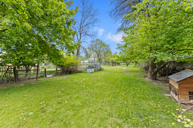 658 North 100 East Logan, UT 84321 - Photo 17 of 26 Expansive green lawn framed by mature trees