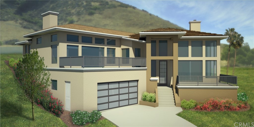 1253 Costa Brava Pismo Beach, CA 93449 - Photo 2 of 13 a front view of a house with a garden