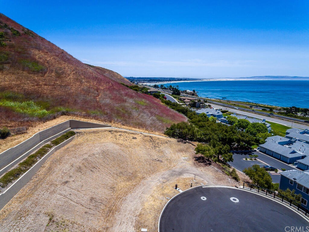 1253 Costa Brava Pismo Beach, CA 93449 - Photo 10 of 13 a view of a dry yard with wooden fence