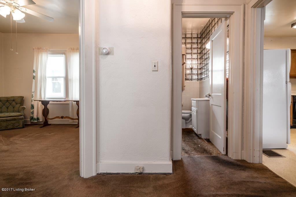 3836 Ormond Road Louisville, KY 40207 - Photo 11 of 43 Hall leading to first floor bedroom, full bath, kitchen, dining and turned basement entry