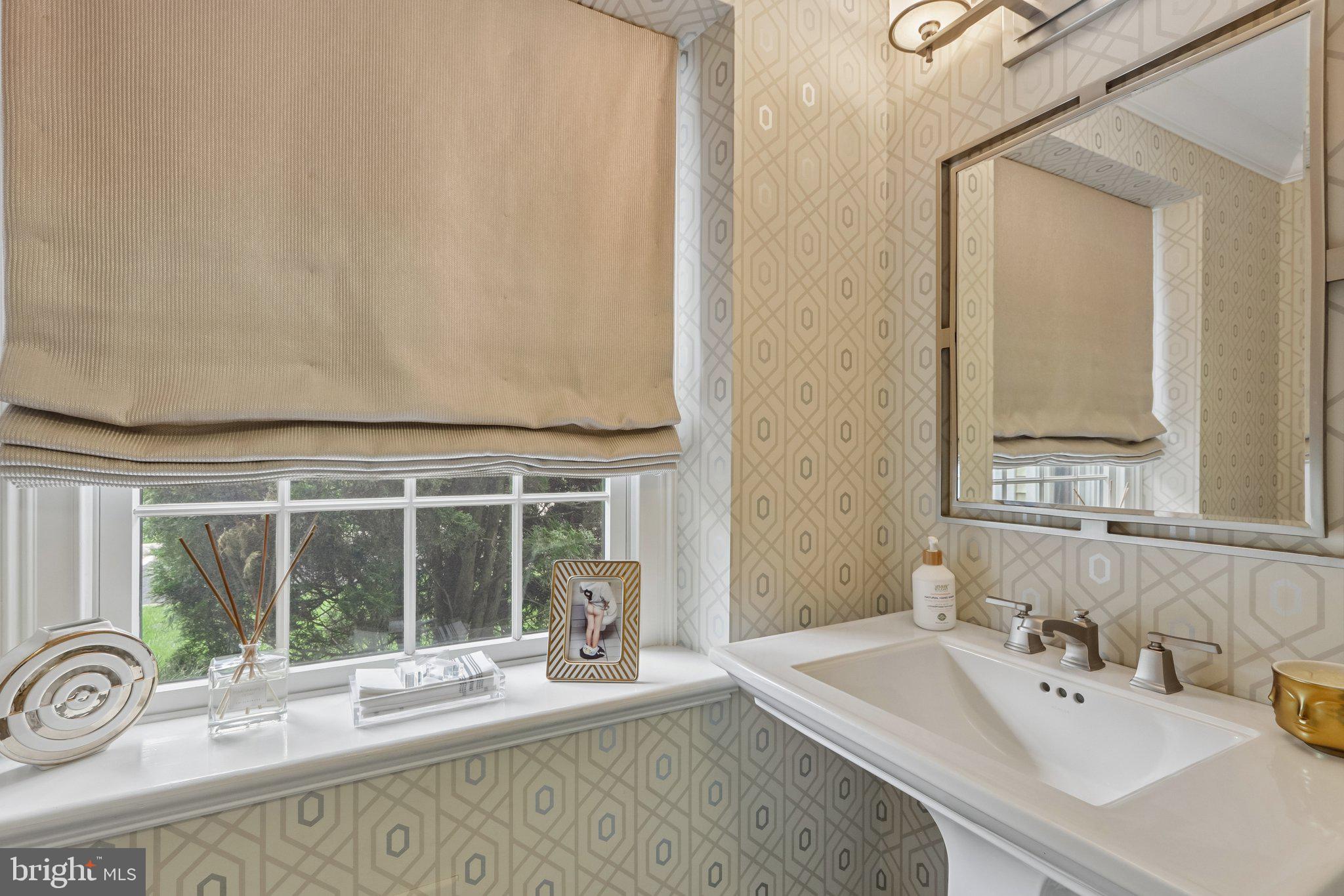 209 Welsh Road Ambler, PA 19002 - Photo 28 of 80 a bathroom with a sink and a mirror