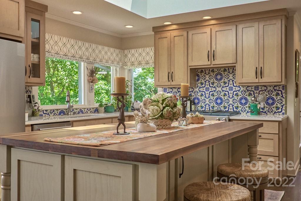 400 Ridgetop Road Tryon, NC 28782 - Photo 18 of 39 a kitchen with a sink and wooden cabinets