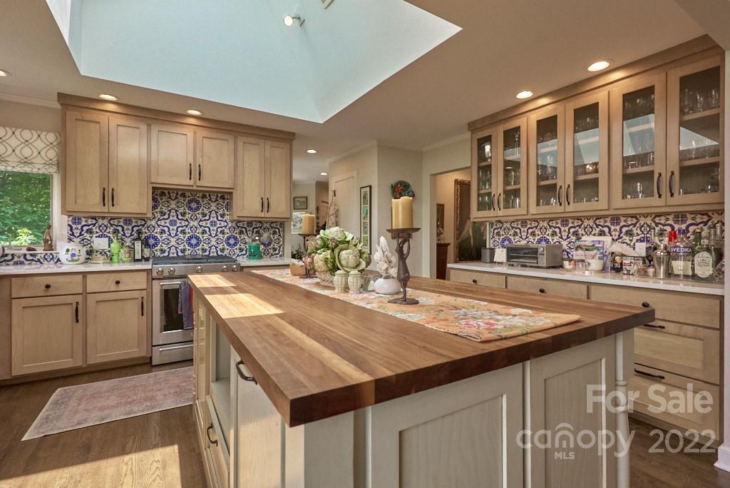400 Ridgetop Road Tryon, NC 28782 - Photo 19 of 39 a kitchen with kitchen island granite countertop a sink and cabinets