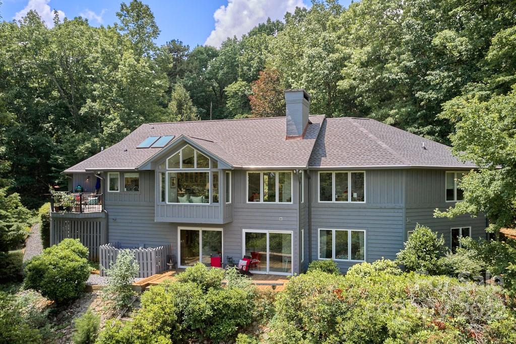 400 Ridgetop Road Tryon, NC 28782 - Photo 2 of 39 a front view of a house with a yard