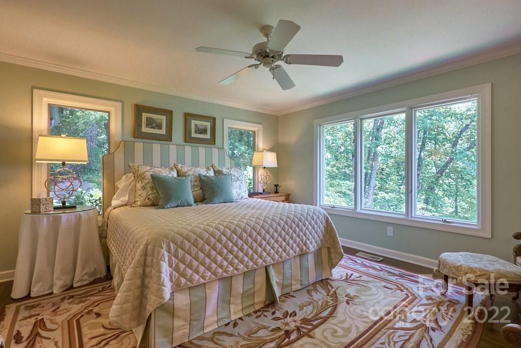 400 Ridgetop Road Tryon, NC 28782 - Photo 24 of 39 a bedroom with a bed and wooden floor