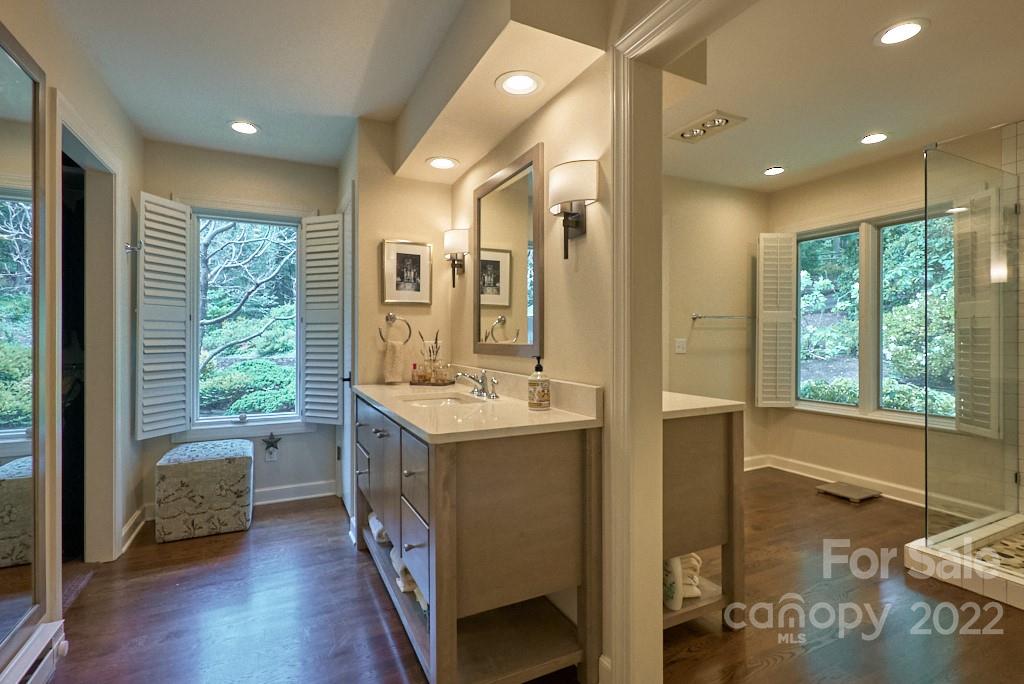 400 Ridgetop Road Tryon, NC 28782 - Photo 25 of 39 a bathroom with a tub sink and mirror