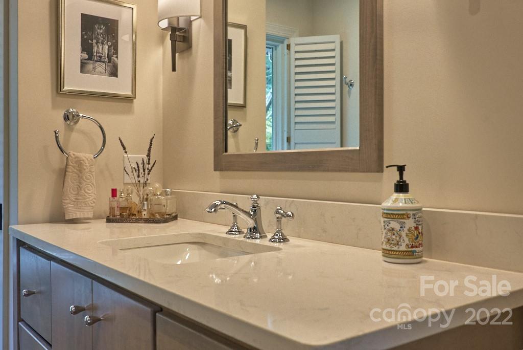 400 Ridgetop Road Tryon, NC 28782 - Photo 26 of 39 a bathroom with a sink and a mirror