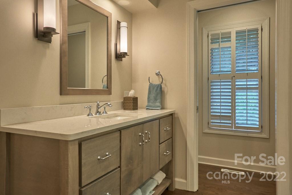 400 Ridgetop Road Tryon, NC 28782 - Photo 27 of 39 a bathroom with a sink and a mirror
