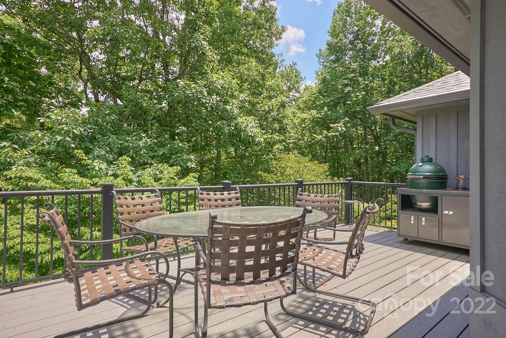 400 Ridgetop Road Tryon, NC 28782 - Photo 3 of 39 a view of a chairs and table on the deck