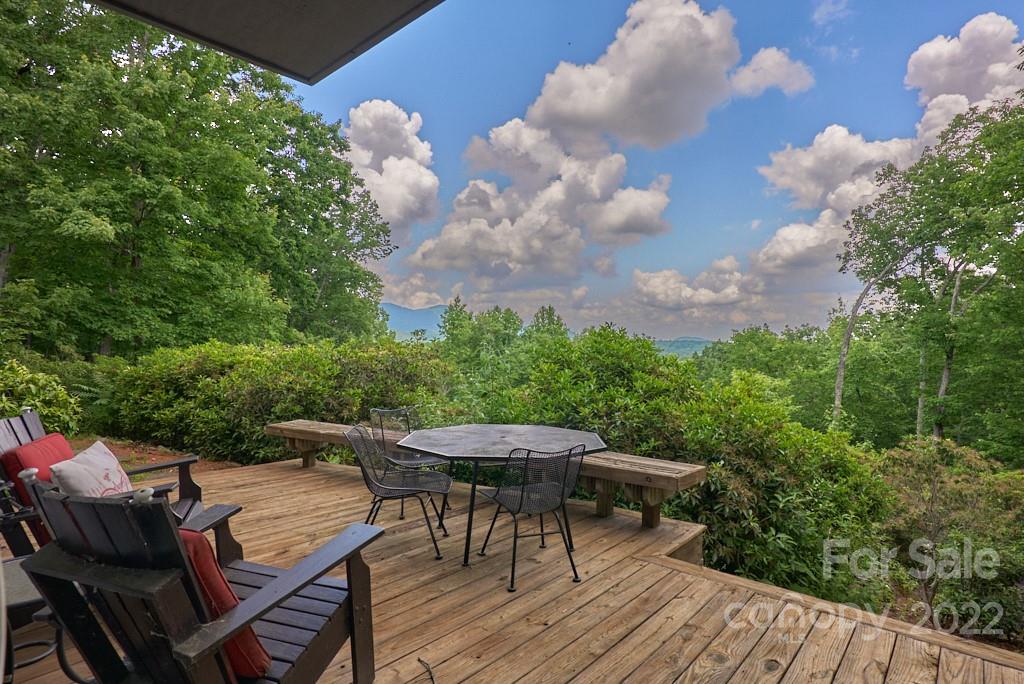 400 Ridgetop Road Tryon, NC 28782 - Photo 33 of 39 a view of a roof deck with table and chairs and wooden floor