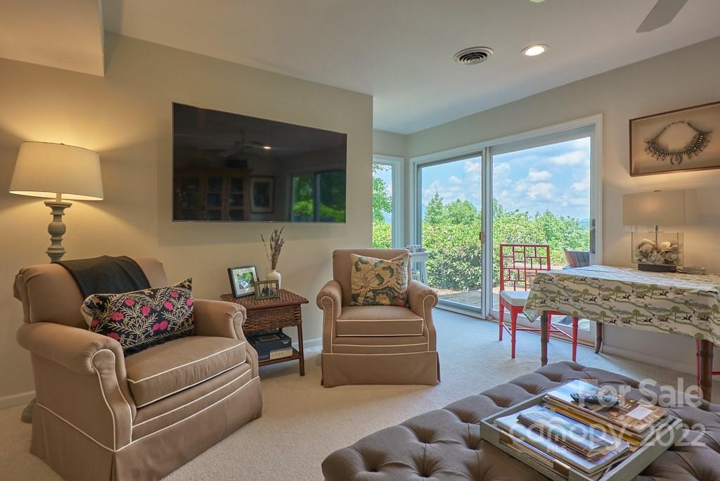 400 Ridgetop Road Tryon, NC 28782 - Photo 34 of 39 a living room with furniture and a floor to ceiling window