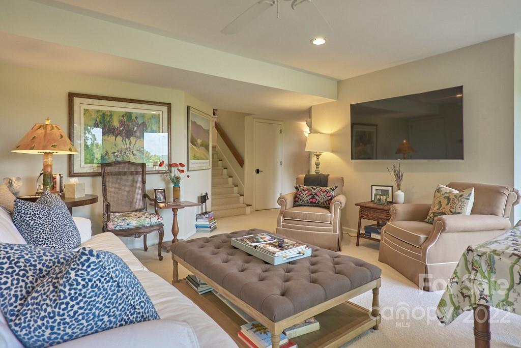 400 Ridgetop Road Tryon, NC 28782 - Photo 35 of 39 a living room with furniture and a flat screen tv