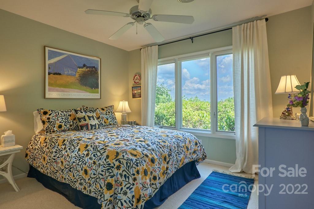 400 Ridgetop Road Tryon, NC 28782 - Photo 36 of 39 a bedroom with a large bed and a window