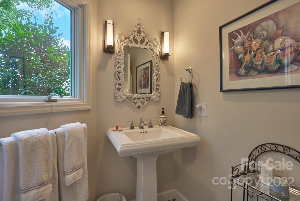 400 Ridgetop Road Tryon, NC 28782 - Photo 39 of 39 a bathroom with a sink and mirror