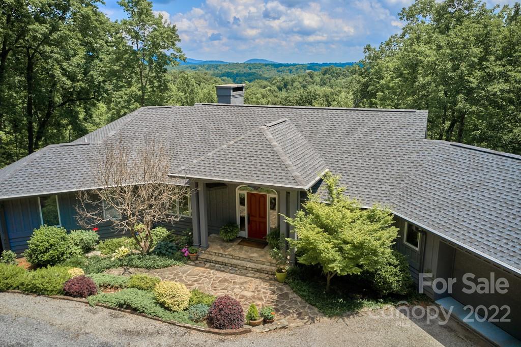 400 Ridgetop Road Tryon, NC 28782 - Photo 5 of 39 a aerial view of a house with a yard and potted plants