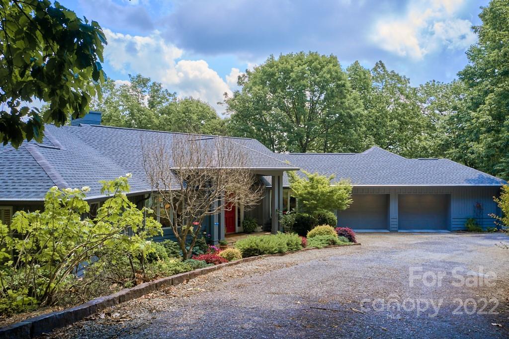 400 Ridgetop Road Tryon, NC 28782 - Photo 6 of 39 a view of a house with a garden
