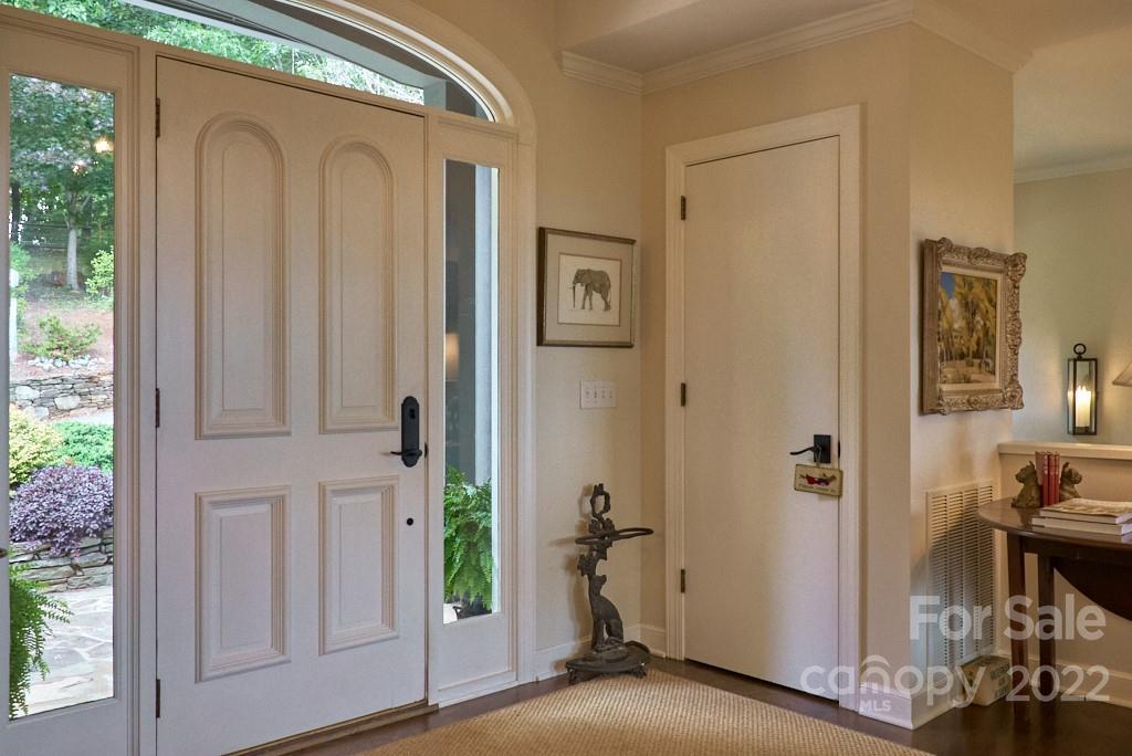 400 Ridgetop Road Tryon, NC 28782 - Photo 10 of 39 a view of a hallway with wooden floor and a livingroom