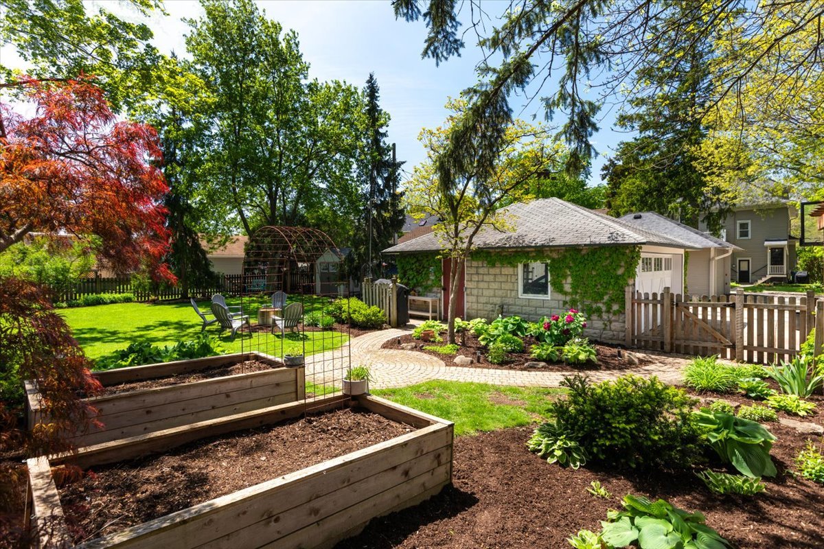 23 Columbia Street Naperville, IL 60540 - Photo 84 of 94 a view of a house with a yard and a garden