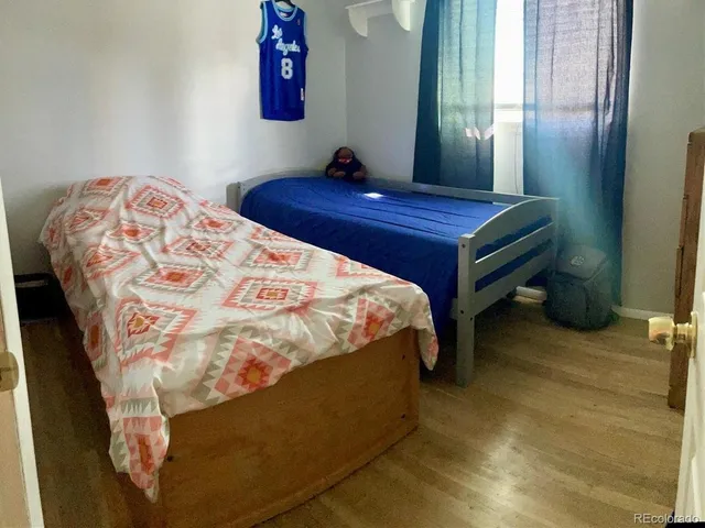 a bedroom with a bed and a mirror