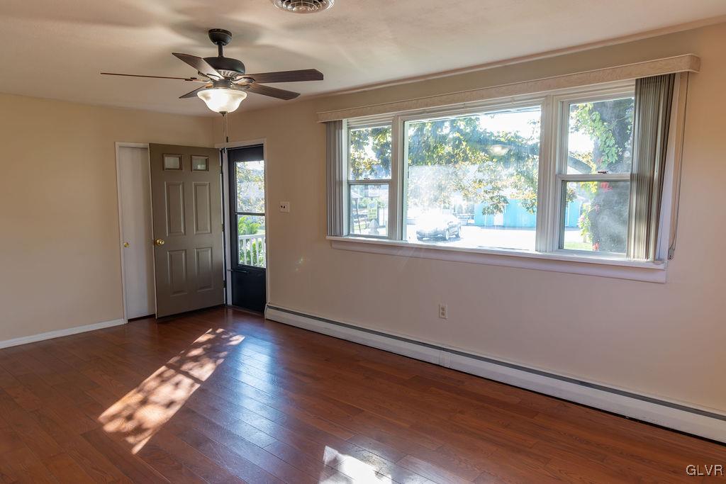 574 Bangor Road Easton, PA 18040 - Photo 3 of 39 a view of an empty room with wooden floor and a window