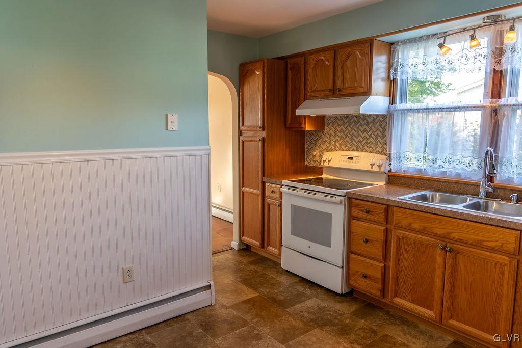 574 Bangor Road Easton, PA 18040 - Photo 9 of 39 a kitchen with white cabinets and white appliances