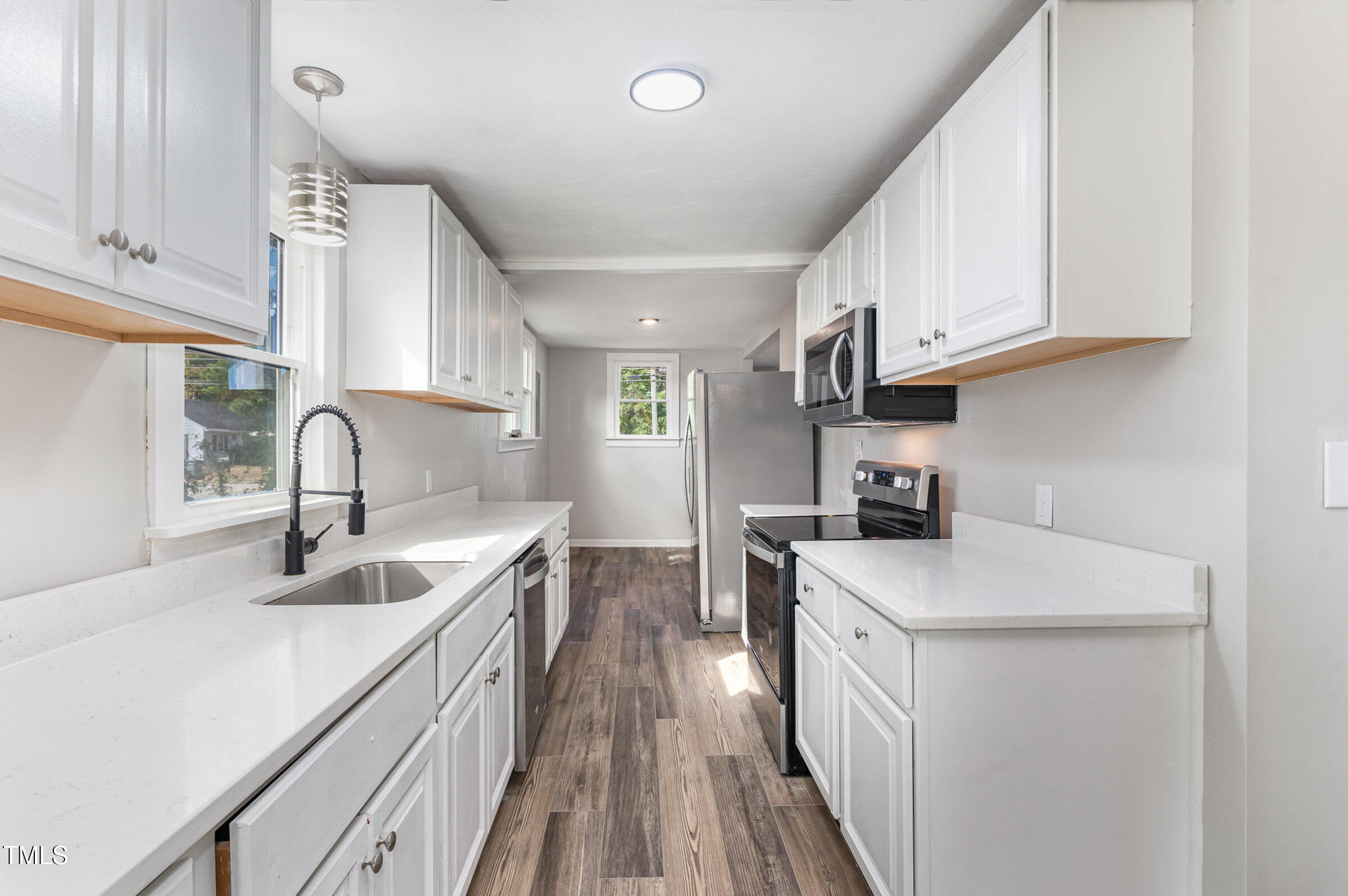 1323 Camden Road Fayetteville, NC 28306 - Photo 11 of 30 a kitchen with kitchen island granite countertop a sink stainless steel appliances and cabinets