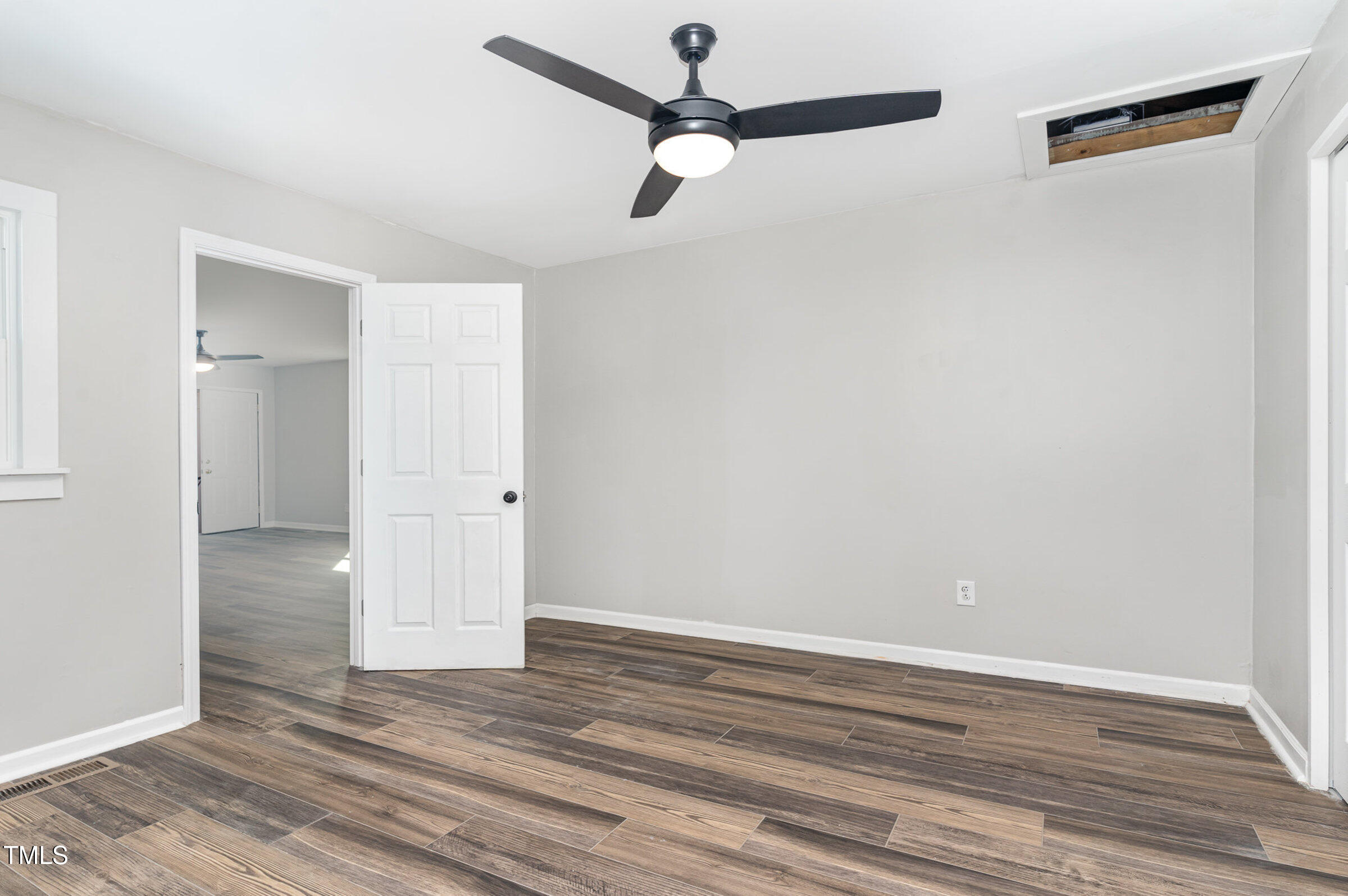 1323 Camden Road Fayetteville, NC 28306 - Photo 20 of 30 a view of a room with wooden floor and fan