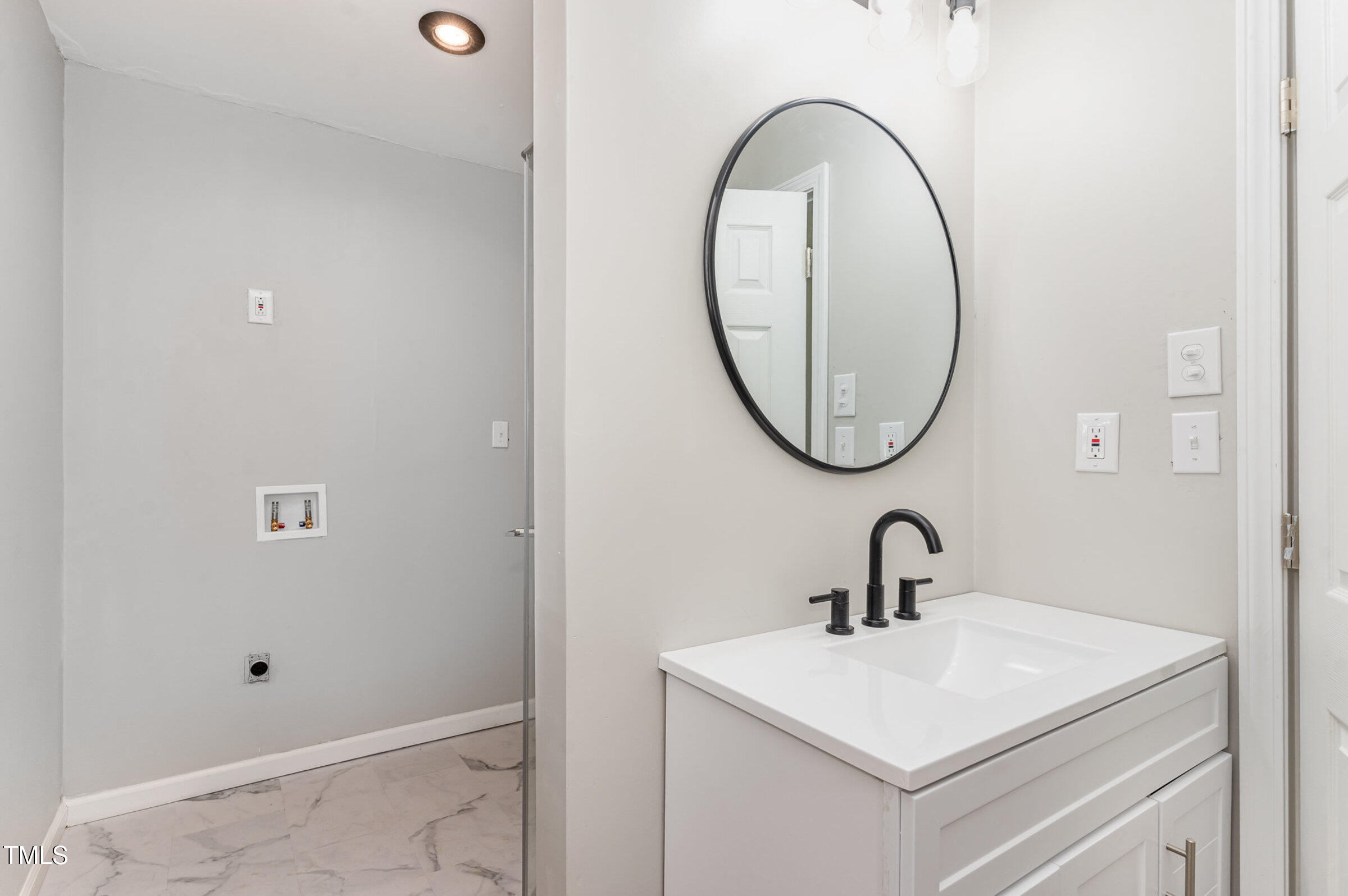 1323 Camden Road Fayetteville, NC 28306 - Photo 22 of 30 a bathroom with a sink and a mirror
