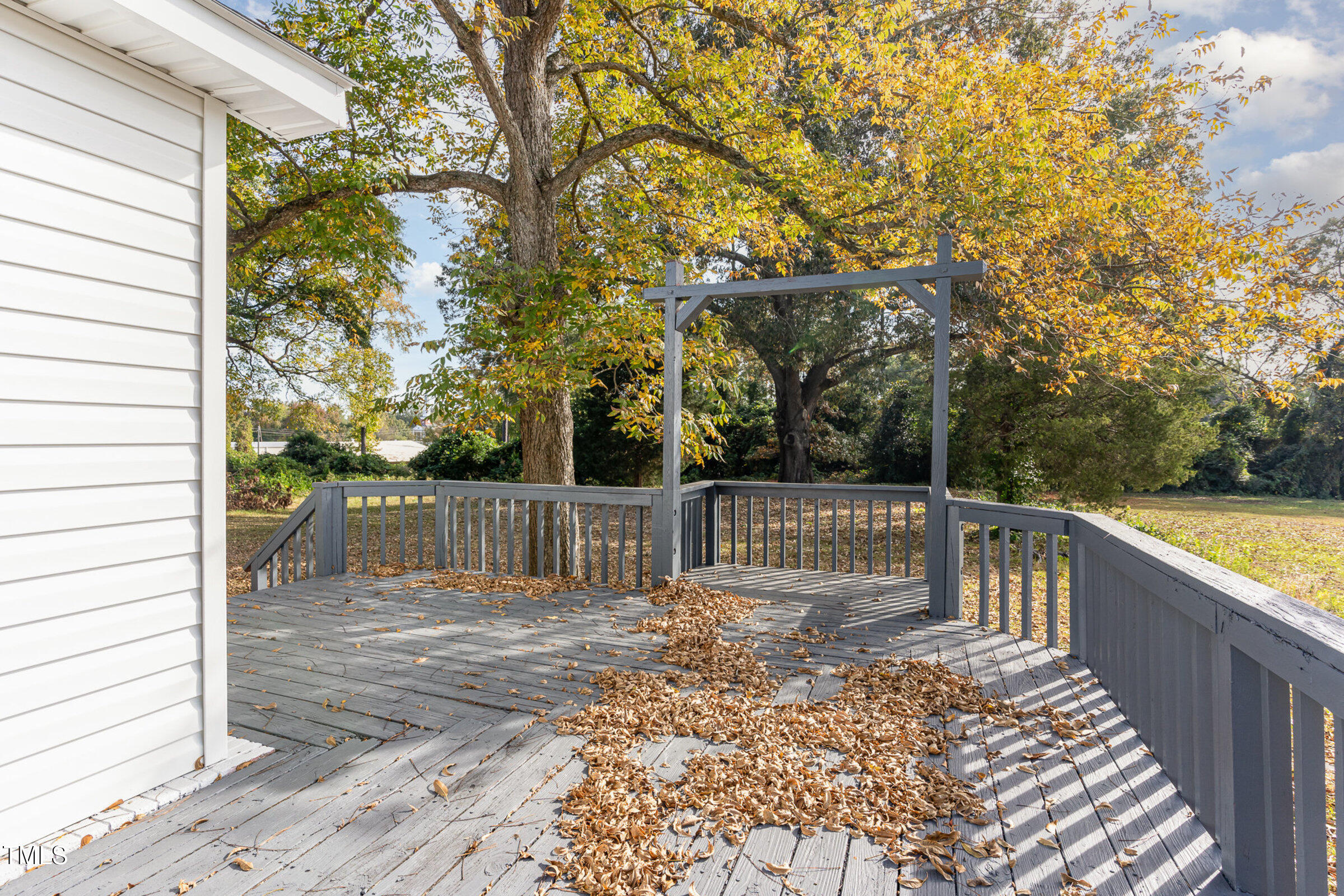 1323 Camden Road Fayetteville, NC 28306 - Photo 25 of 30 a view of balcony with wooden floor and fence