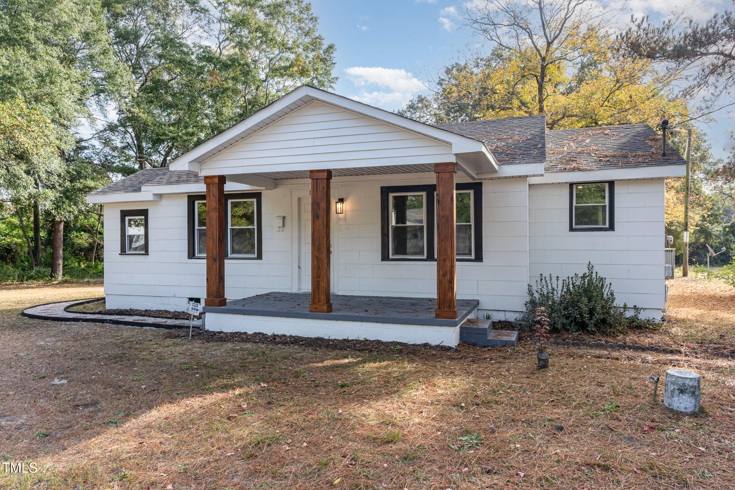 1323 Camden Road Fayetteville, NC 28306 - Photo 3 of 30 a front view of a house with garden