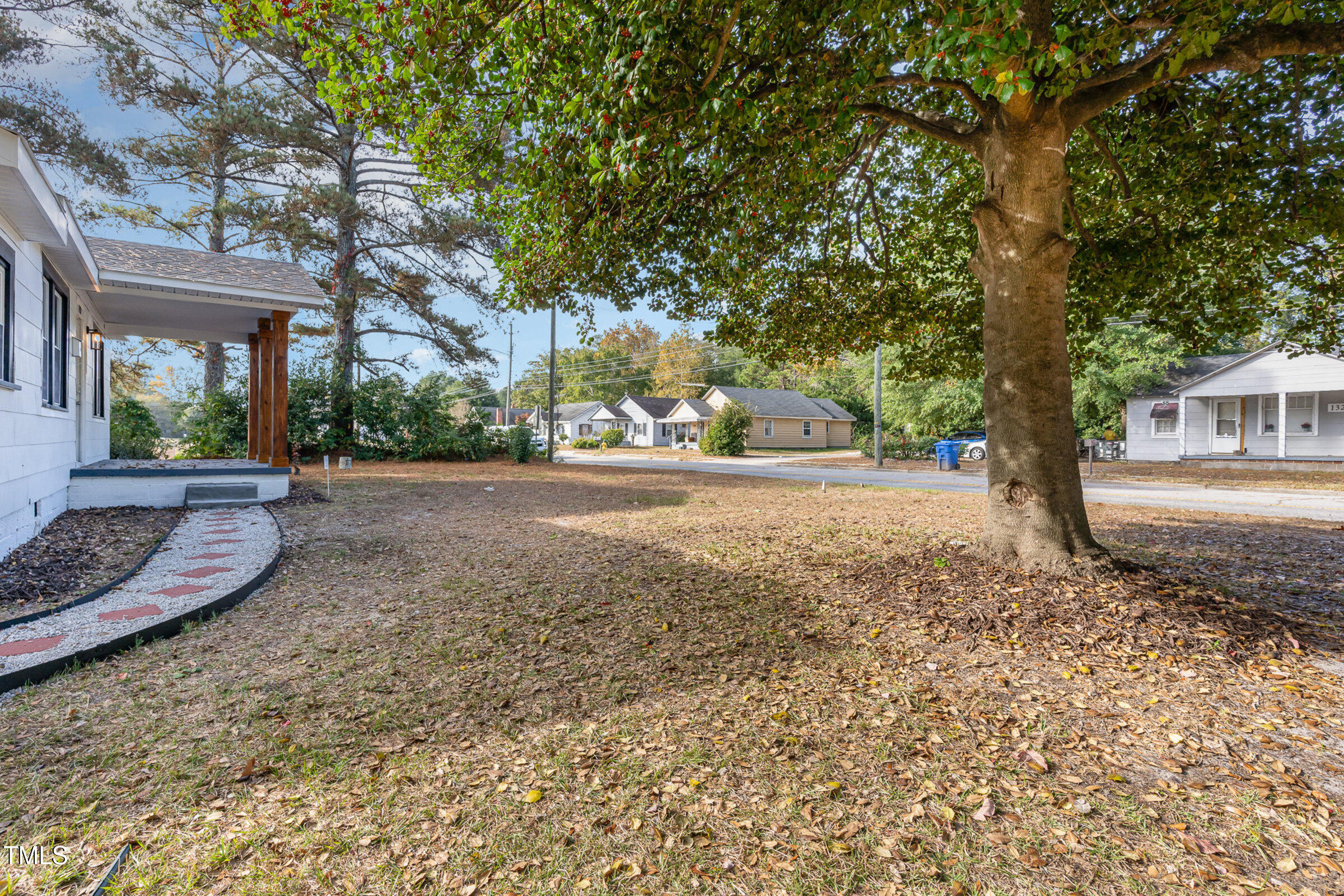 1323 Camden Road Fayetteville, NC 28306 - Photo 4 of 30 a view of a yard with plants and trees