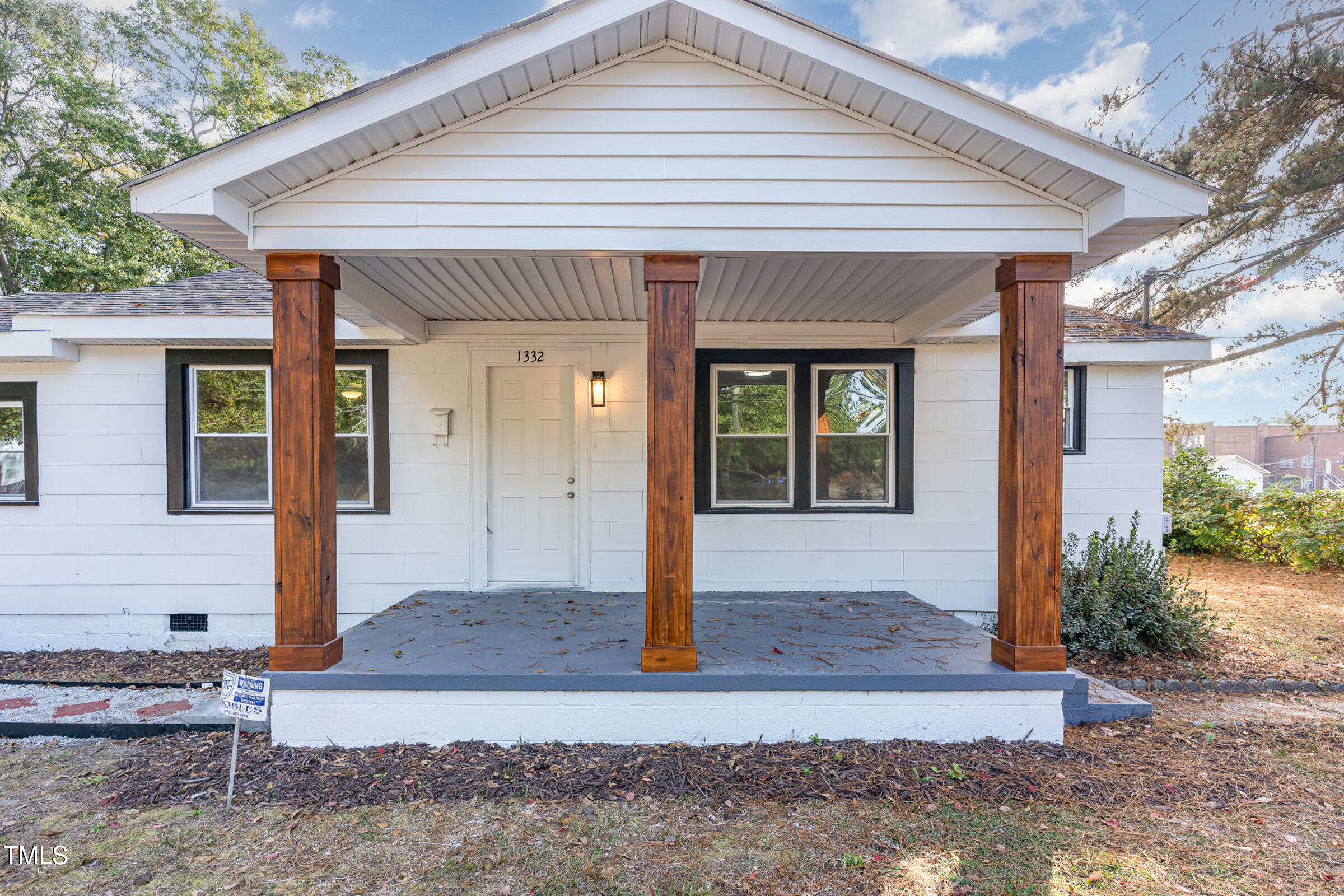 1323 Camden Road Fayetteville, NC 28306 - Photo 5 of 30 a front view of house with small garden