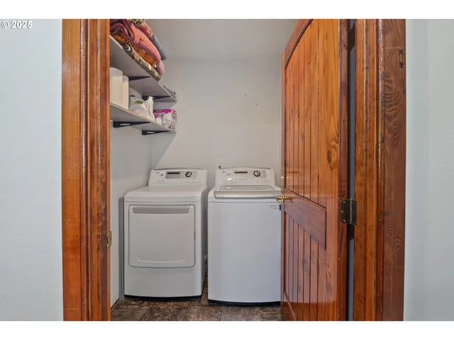 a view of a dining room with furniture wooden floor and chandelier