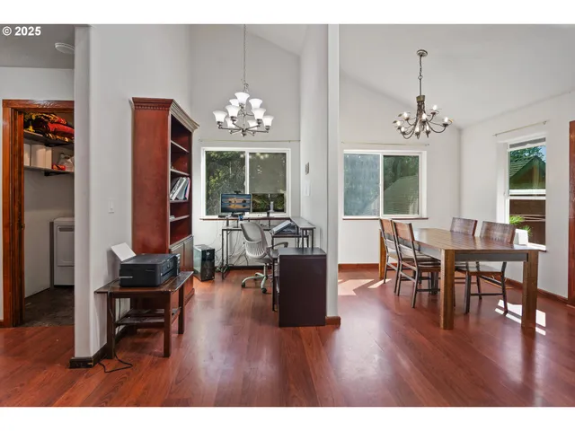 a living room with furniture window and wooden floor