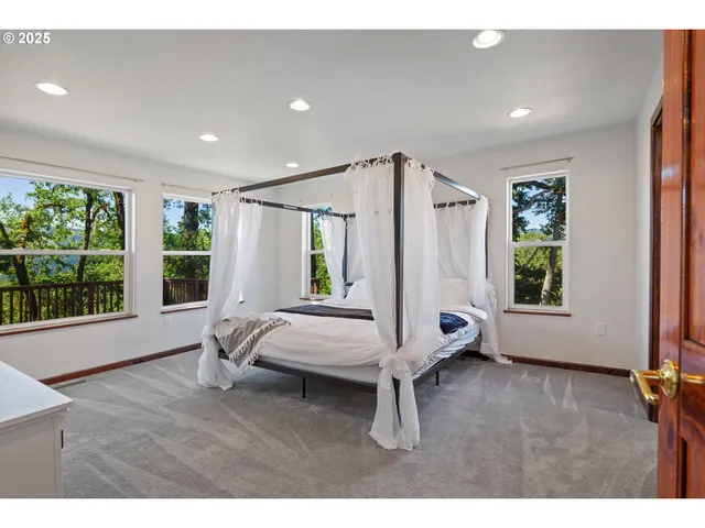 a bedroom with double bed and a window