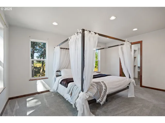 a bathroom with a granite countertop sink mirror and toilet